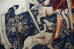 New York Cloisters 58 017 Unicorn Tapestries - The Unicorn Defends Itself Close Up - the injured unicorn reacts with a gruesome attack on a greyhound.jpg